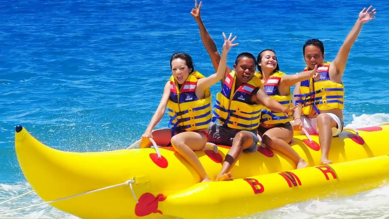 Bali Tour Boat Experience with a boat sailing across the beautiful blue sea near Bali islands